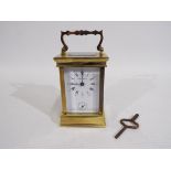 Boodle & Dunthorne - A French gilt brass and glass carriage alarm timepiece retailed by Boodle &