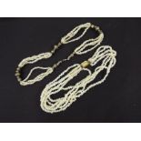 Two multi-strand necklaces, one with gilt metal clasp, longest 47 cm.