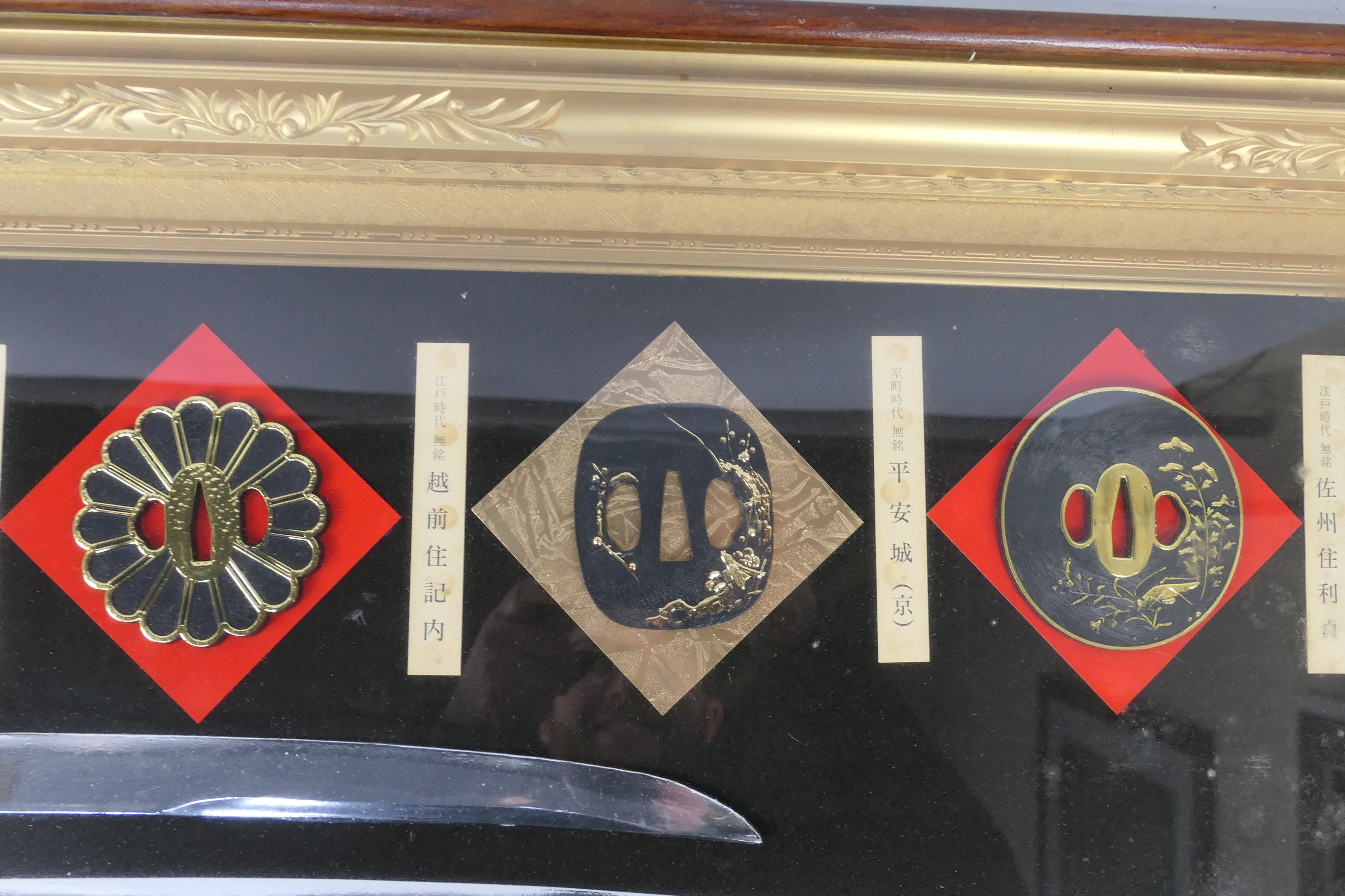 A decorative, framed and glazed sword display comprising five tsuba, tanto blade and wakizashi, - Image 4 of 5