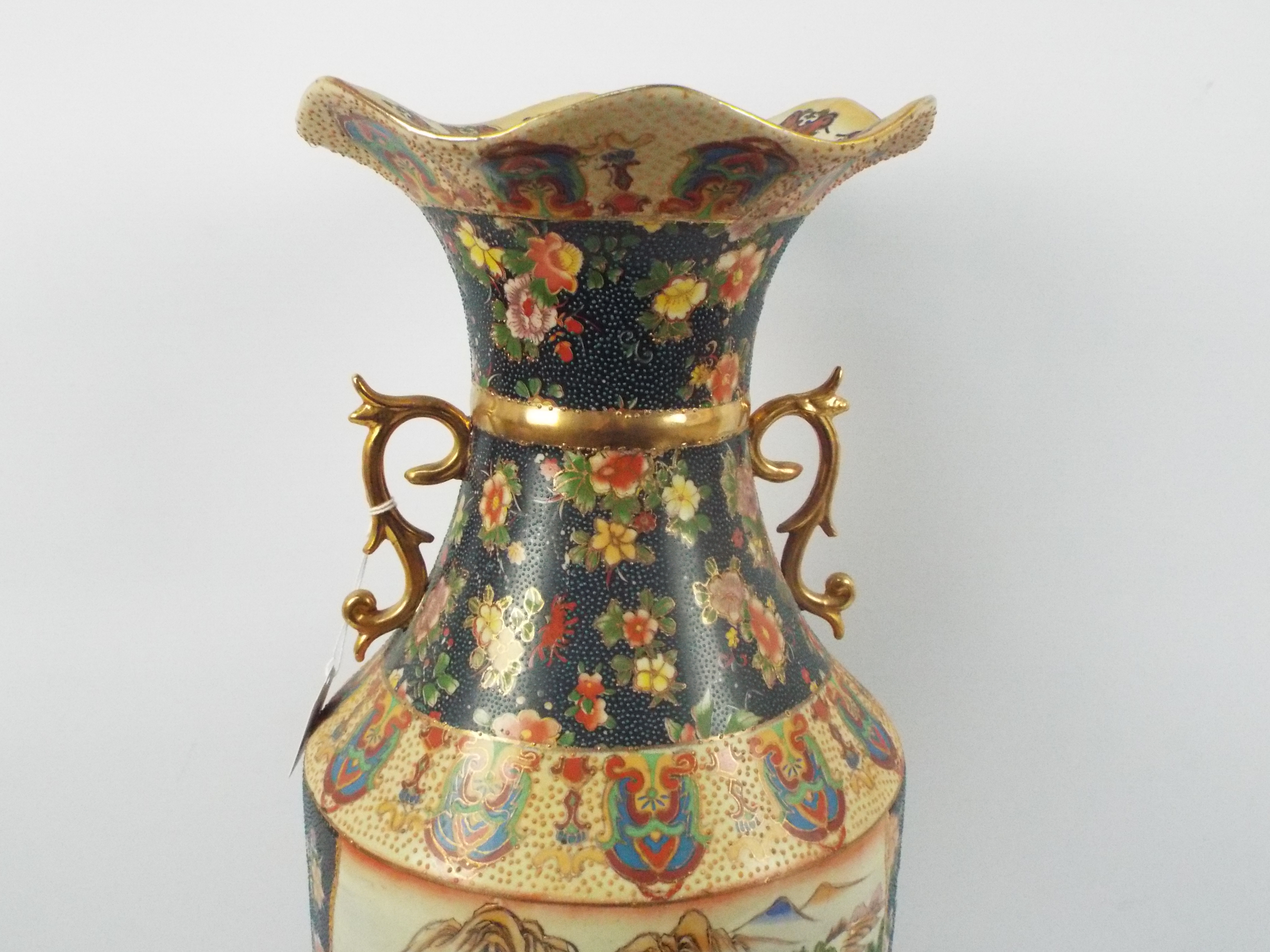 A large Japanese Satsuma ware vase with twin gilt handles decorated with two panels of figures in a - Image 9 of 10