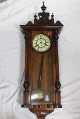 A Vienna style wall clock, walnut case with turned and applied decoration, glazed door,
