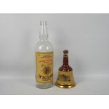 A Wade Bells whisky decanter with contents, 75cl and 40% ABV and an empty 3 litre whisky bottle.