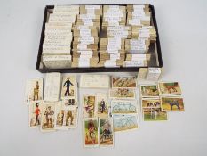 A quantity of cigarette and trade cards comprising Players, Gallaher, Carreras and similar,