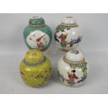 Four Chinese ginger jars including a mirror pair depicting a lady and young boys and similar.