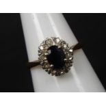 An 18ct gold sapphire and diamond cluster ring, size M, approximately 3.3 grams all in.