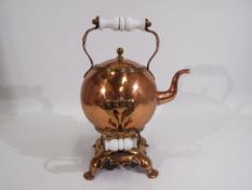 A good quality copper spirit kettle of spherical form, with stand, approximately 35 cm (h).