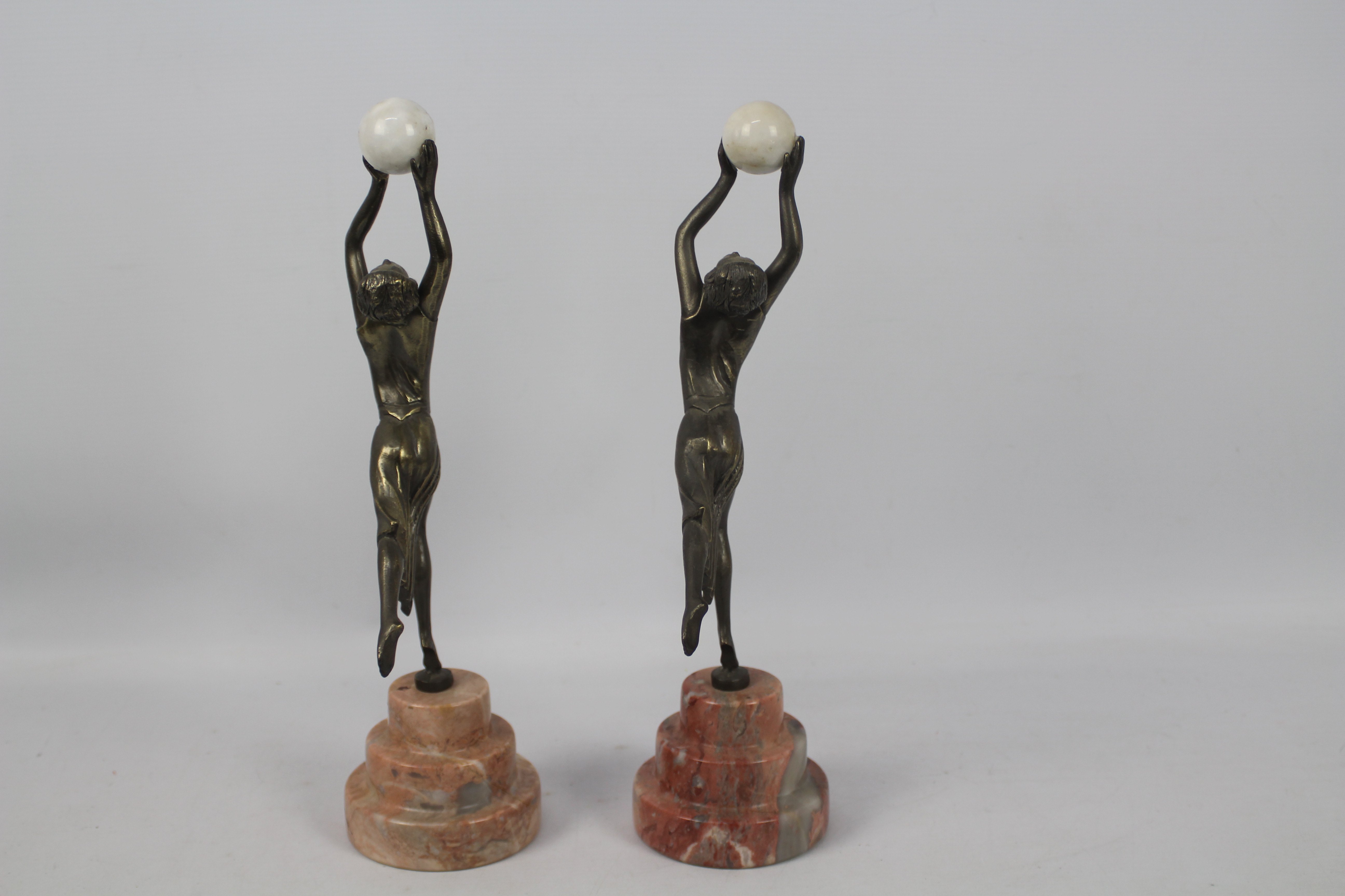 A pair of Art Deco style sculptures modelled as female figures holding aloft spheres, - Image 4 of 6