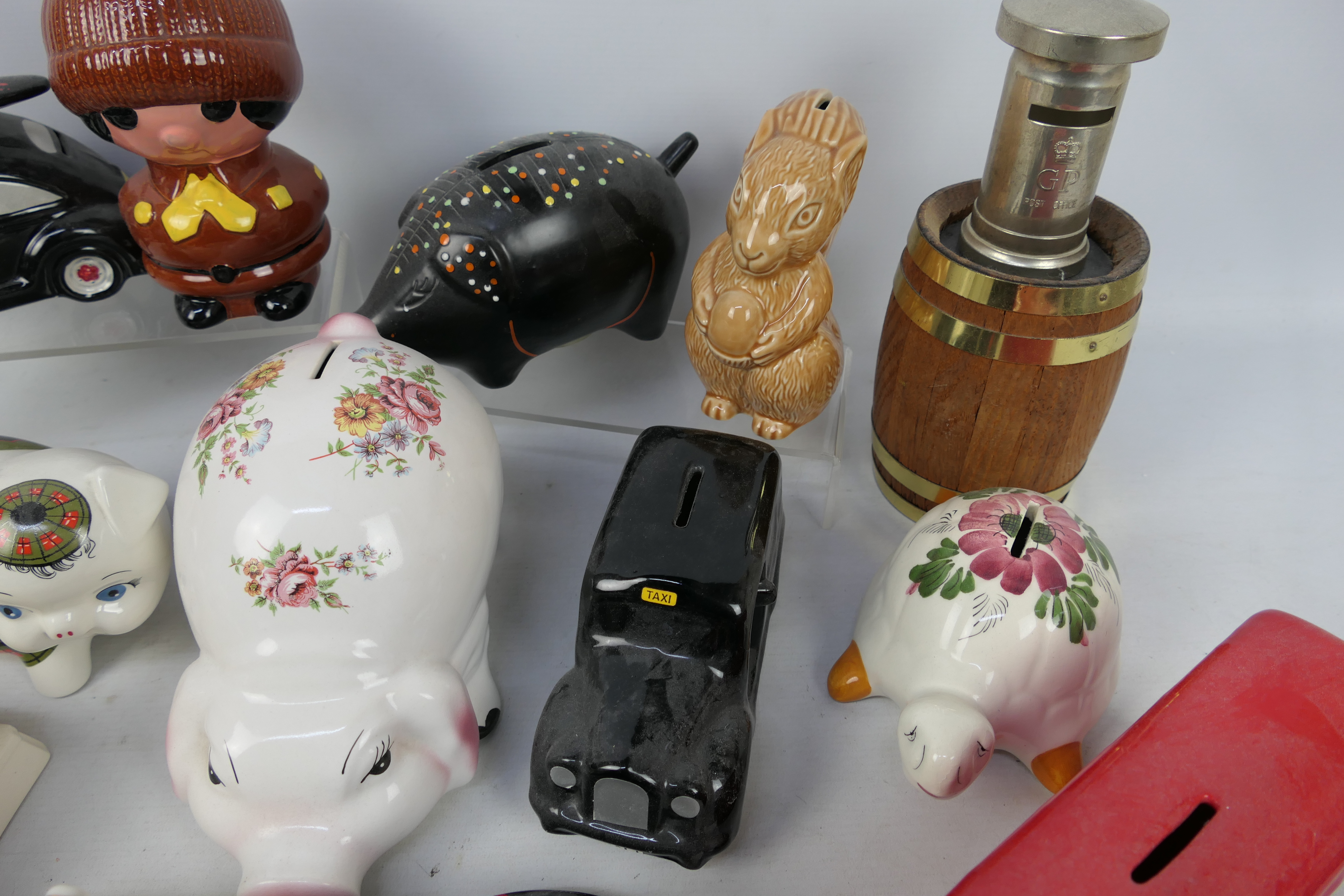 A collection of various money banks, predominantly ceramic, to include Wade. - Image 3 of 4