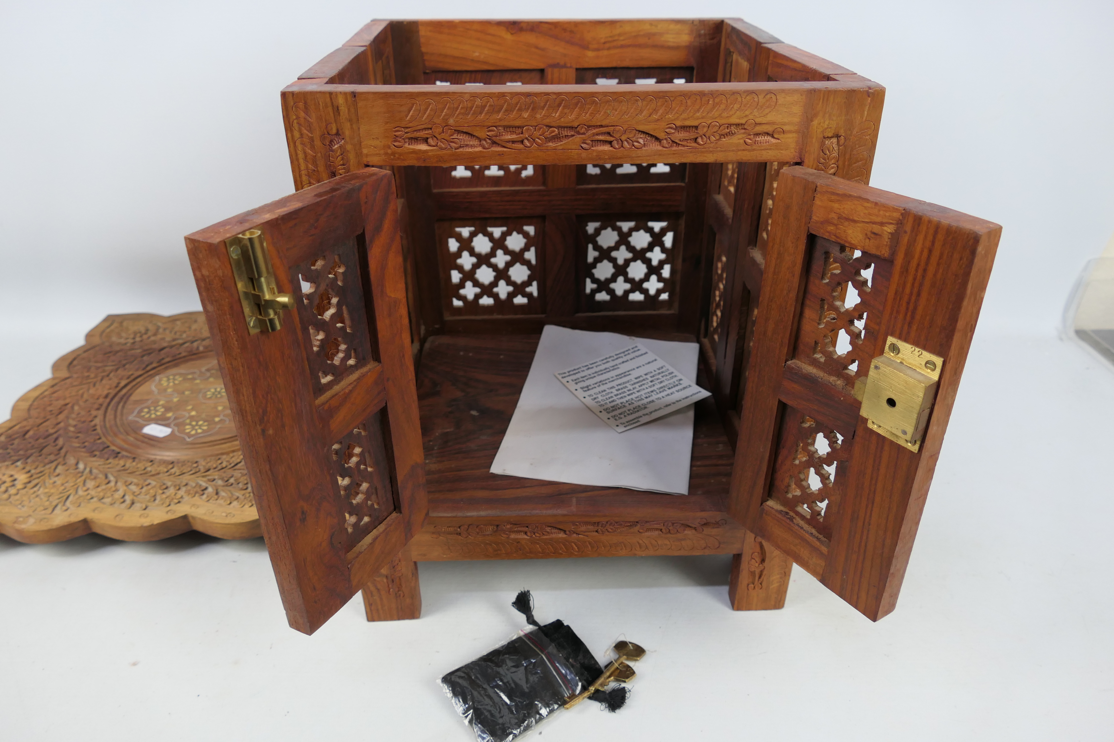 Ethnographica - A square section carved folding table with brass inlay and with enclosed storage , - Image 4 of 4
