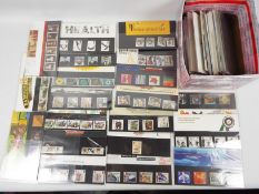 Philately - A quantity of Royal Mail mint stamp presentation packs, in excess of £80 face value.