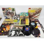 A collection of 7" and 12" vinyl records to include The Beatles, The Doors, ELO, Michael Jackson,