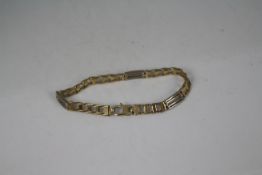 A 9ct yellow and white gold bracelet, 24 cm (l), approximately 22.7 grams all in.
