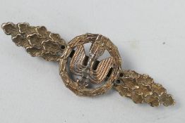 A German Day Fighter Operational Flying Clasp with a central stylized winged arrow within a laurel