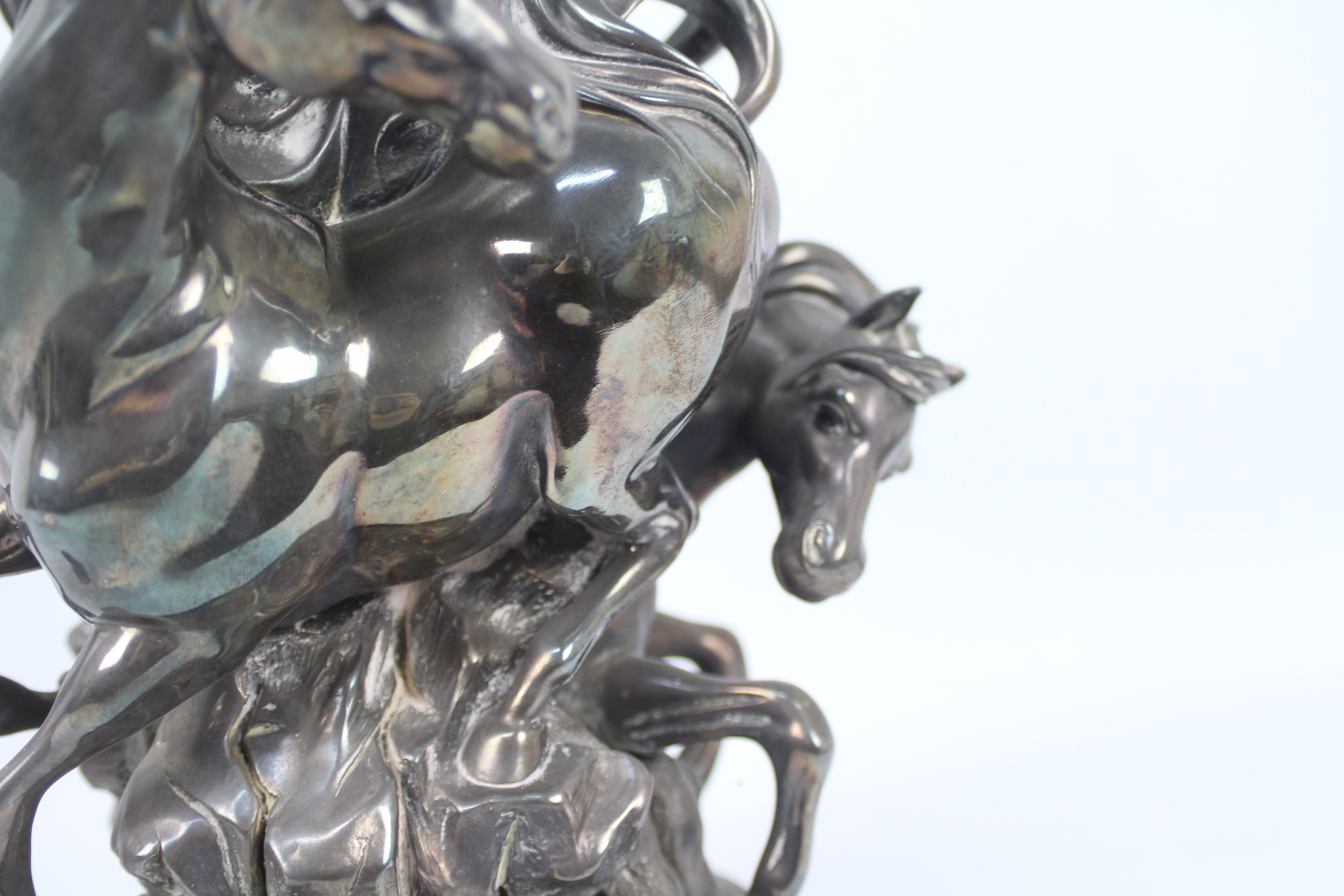 Ottaviani (Italian), 20th century - A silvered sculpture of three horses surmounting a rock, - Image 7 of 7