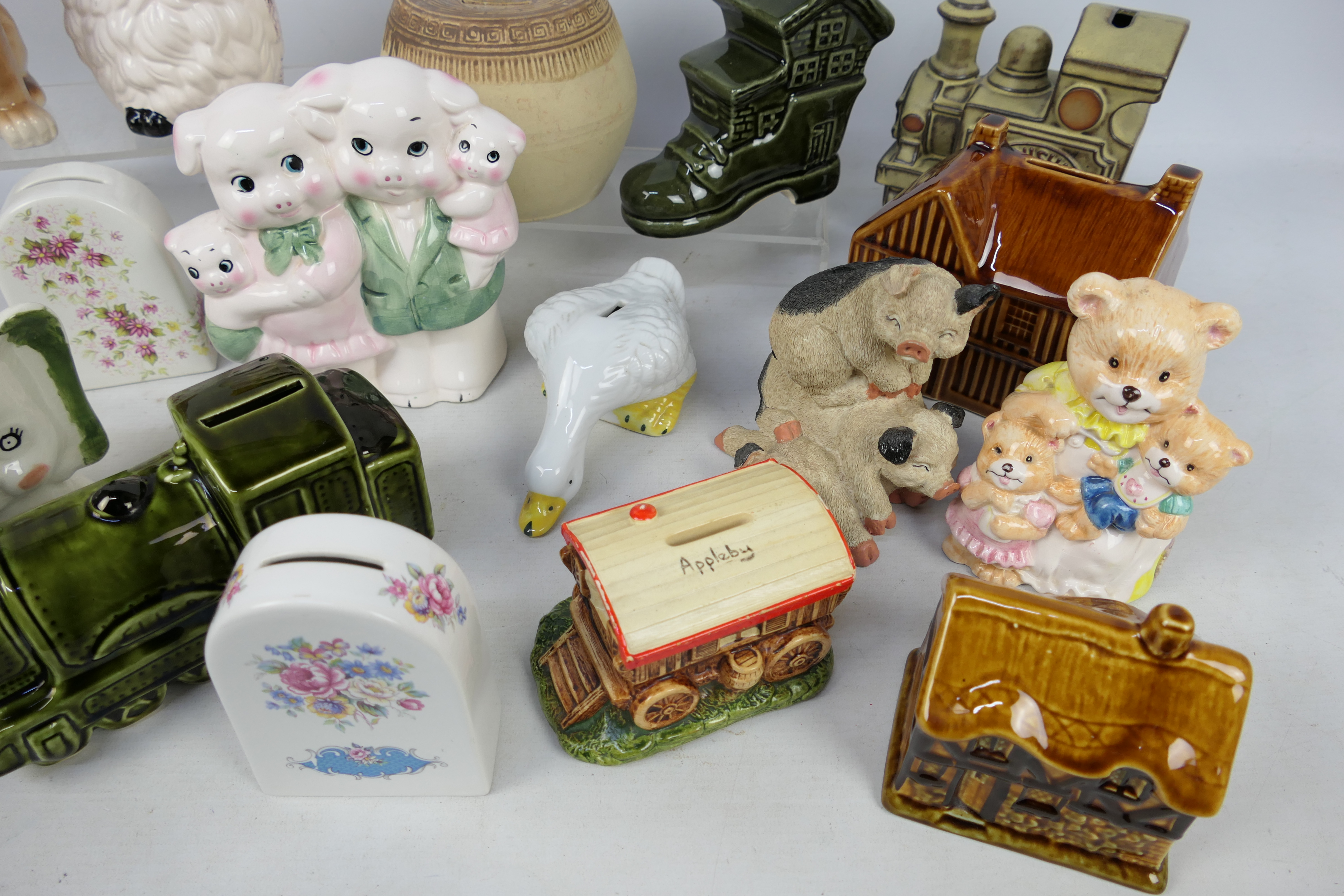 A collection of ceramic money banks. - Image 4 of 5