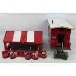 Two scratch built toys, consisting of a red and white wooden Romany Caravan,