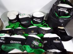 Guinness - A large quantity of Guinness promotional hats.