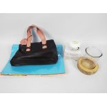 A mixed lot to include a black pvc handbag with pink straps,