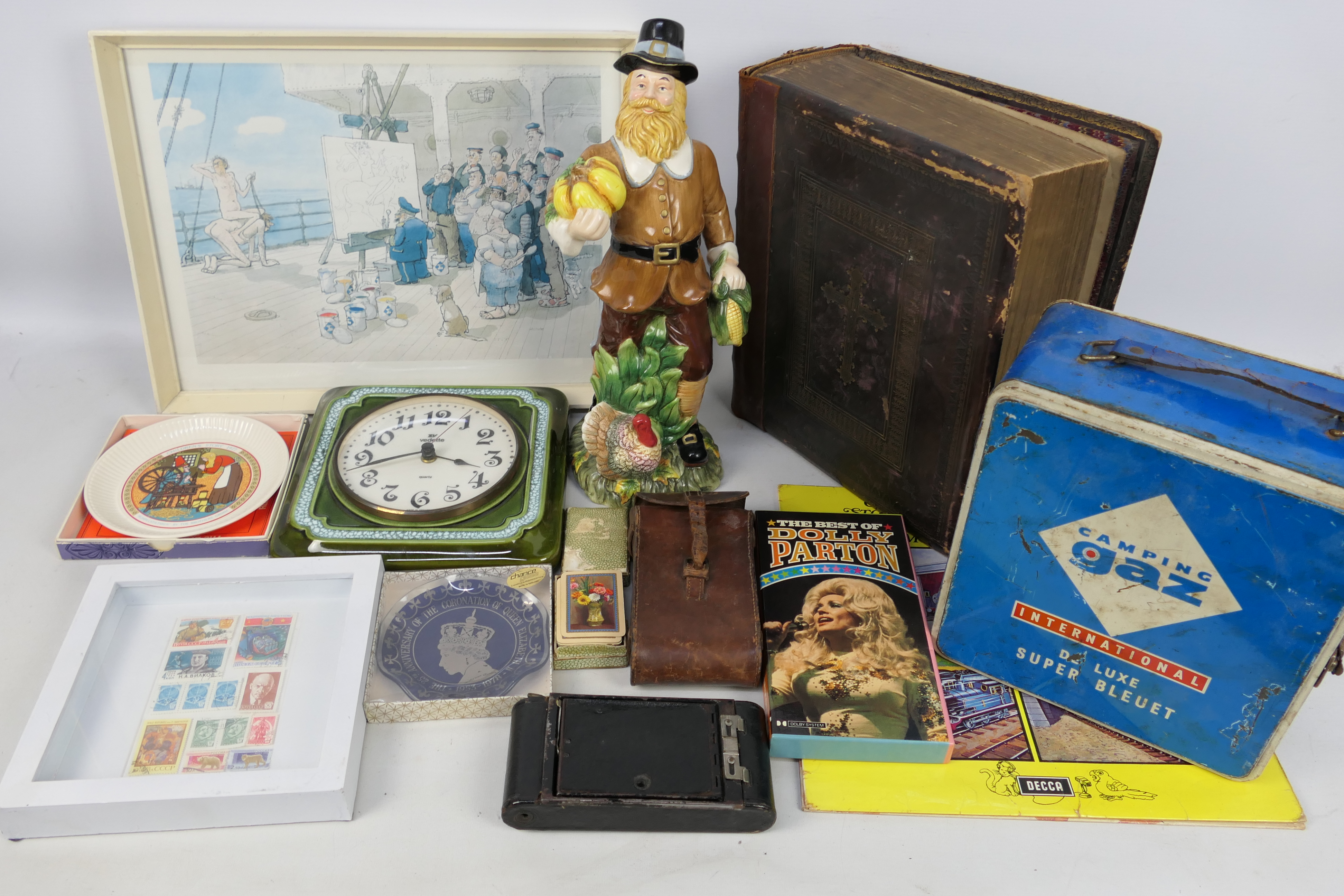 Lot to include a Victorian family bible, camera, ceramic wall clock, playing cards and similar.