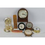 A collection of clocks and thermometers to include a Woodford mantel clock.