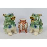 A pair of ceramic Buddhist lions,