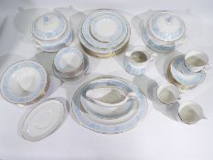 A quantity of Royal Doulton dinner and tea wares in the Hampton Court pattern,