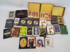Guinness - A collection of Guinness branded playing cards including factory sealed examples.