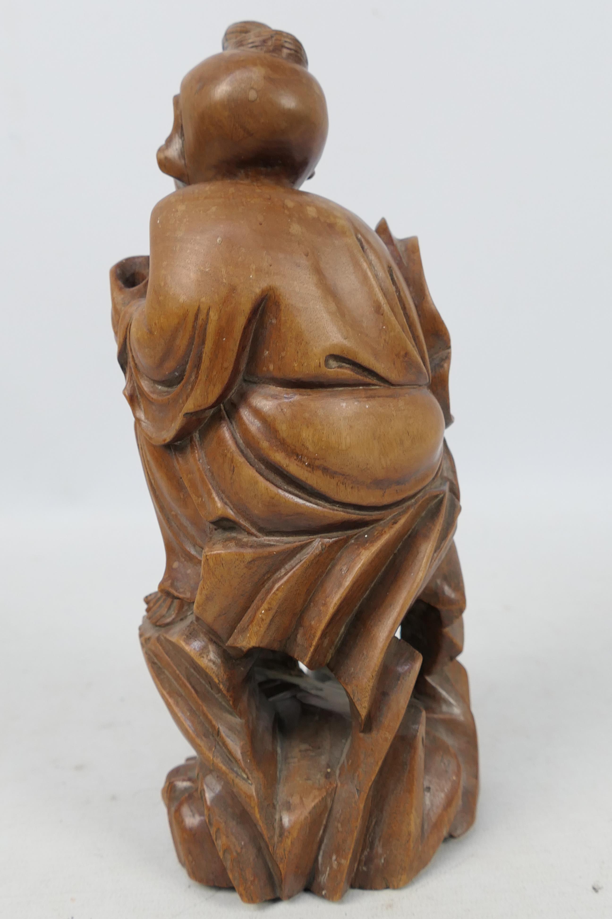 A carved wood figure depicting an elderly gentleman, approximately 24 cm (h). - Image 3 of 3