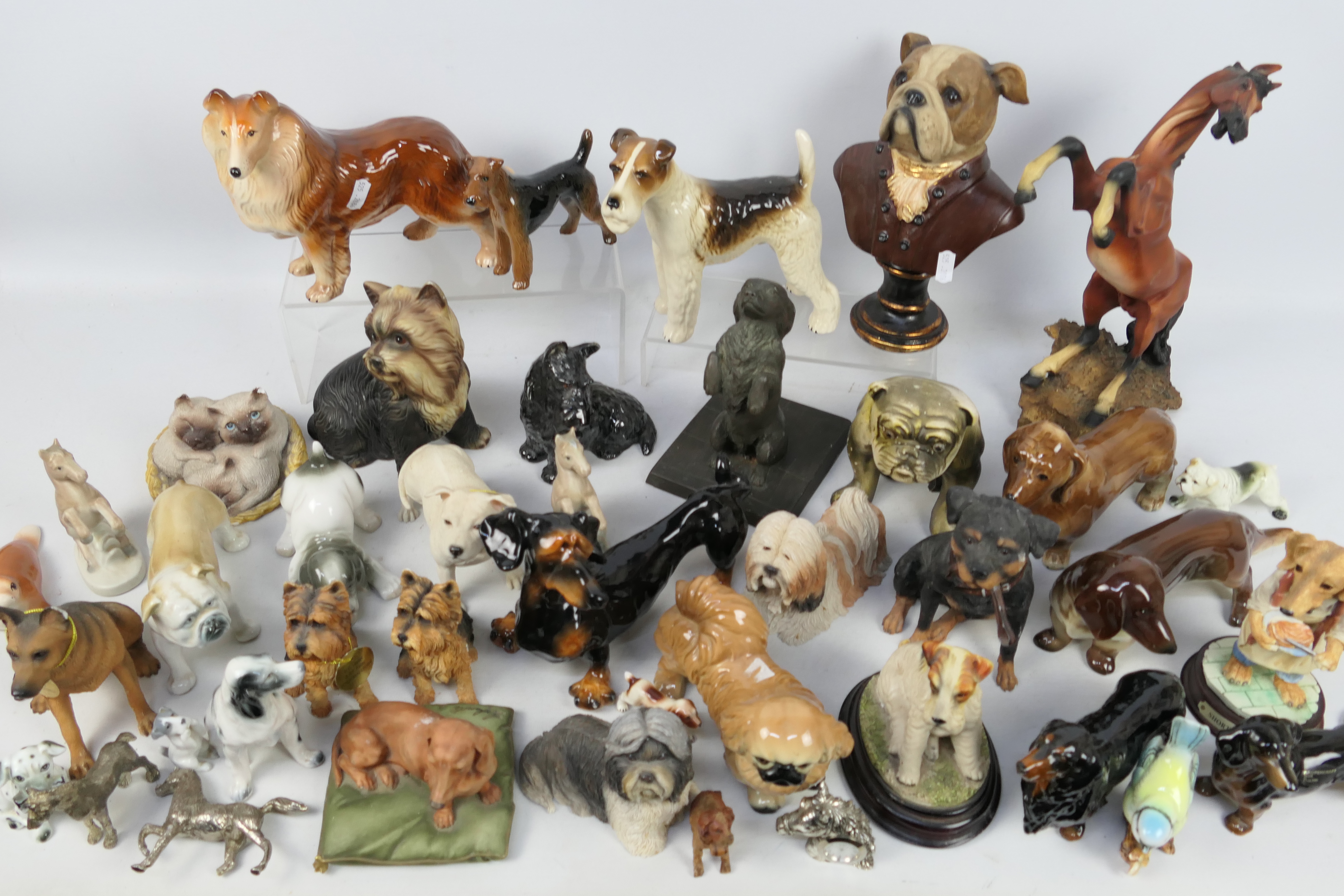 A collection of animal figures / groups, predominantly dogs.