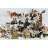 A collection of animal figures / groups, predominantly dogs.
