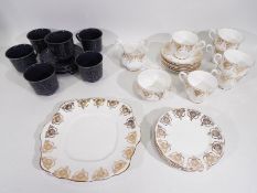 Royal Albert - A collection of tea wares with decoration of gilt floral swags comprising six trios,
