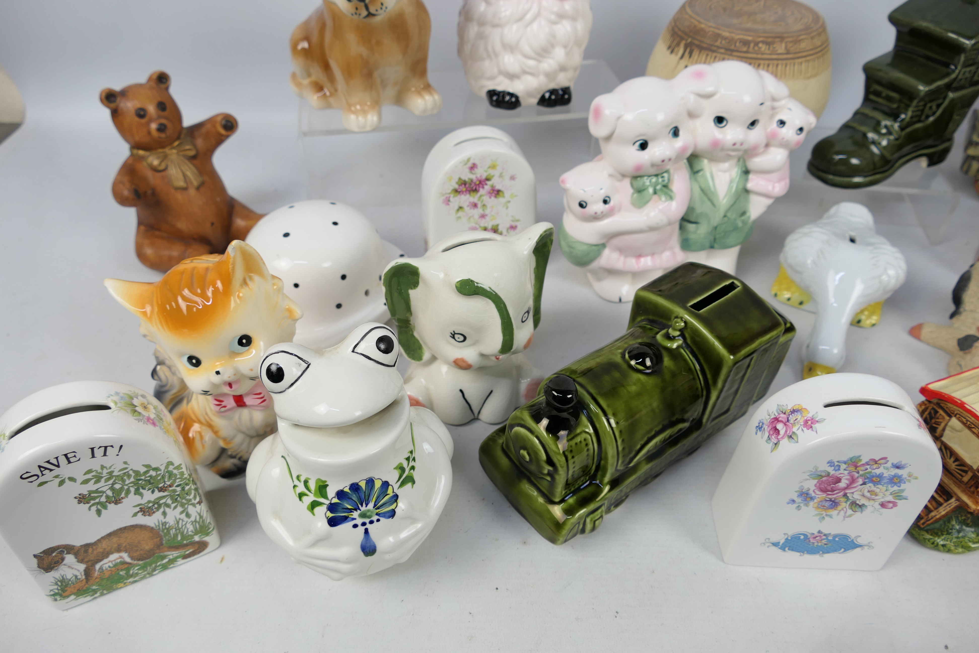 A collection of ceramic money banks. - Image 2 of 5