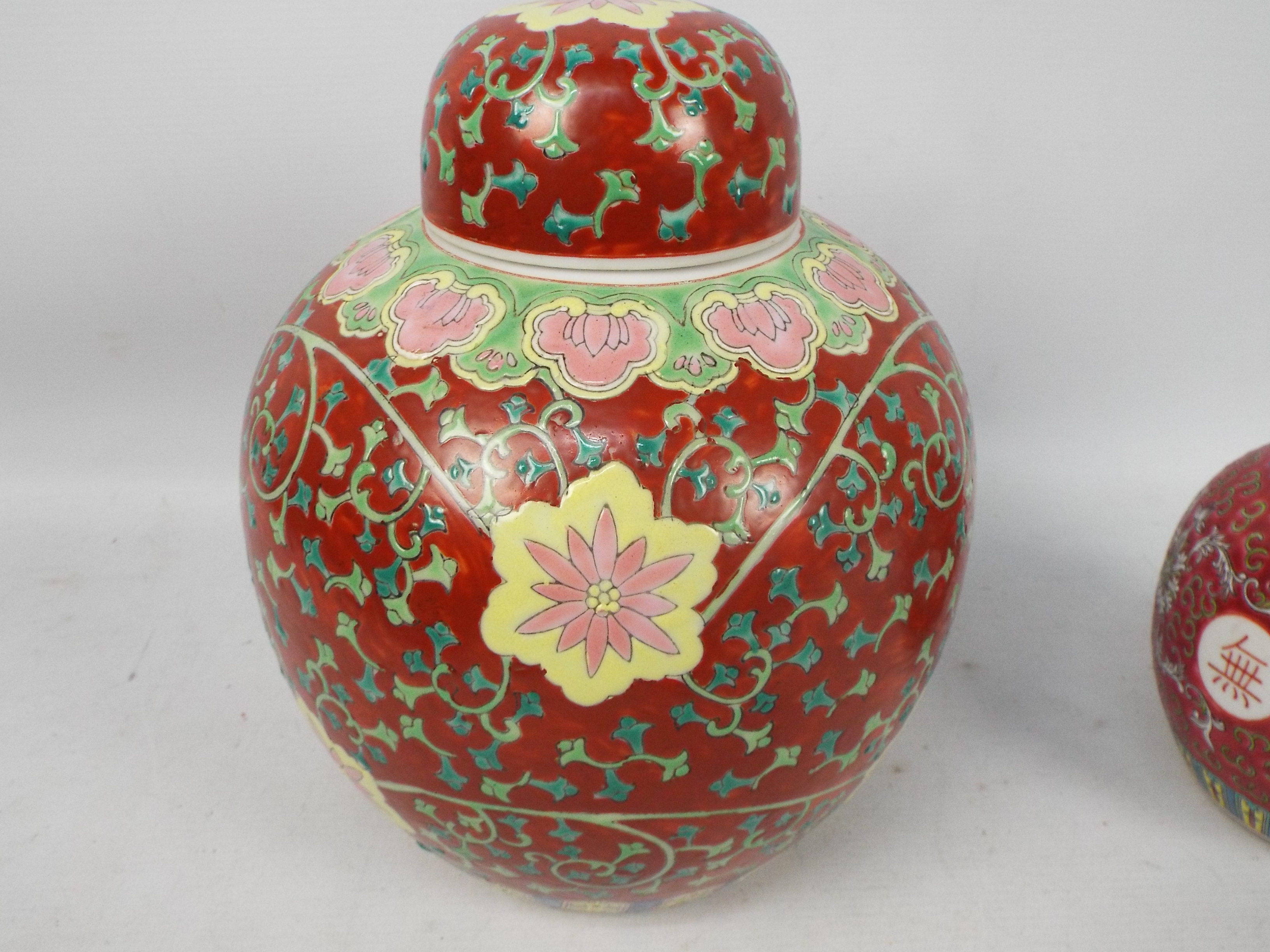 A large ginger jar and cover decorated with floral scrolls against a red ground, - Image 6 of 9