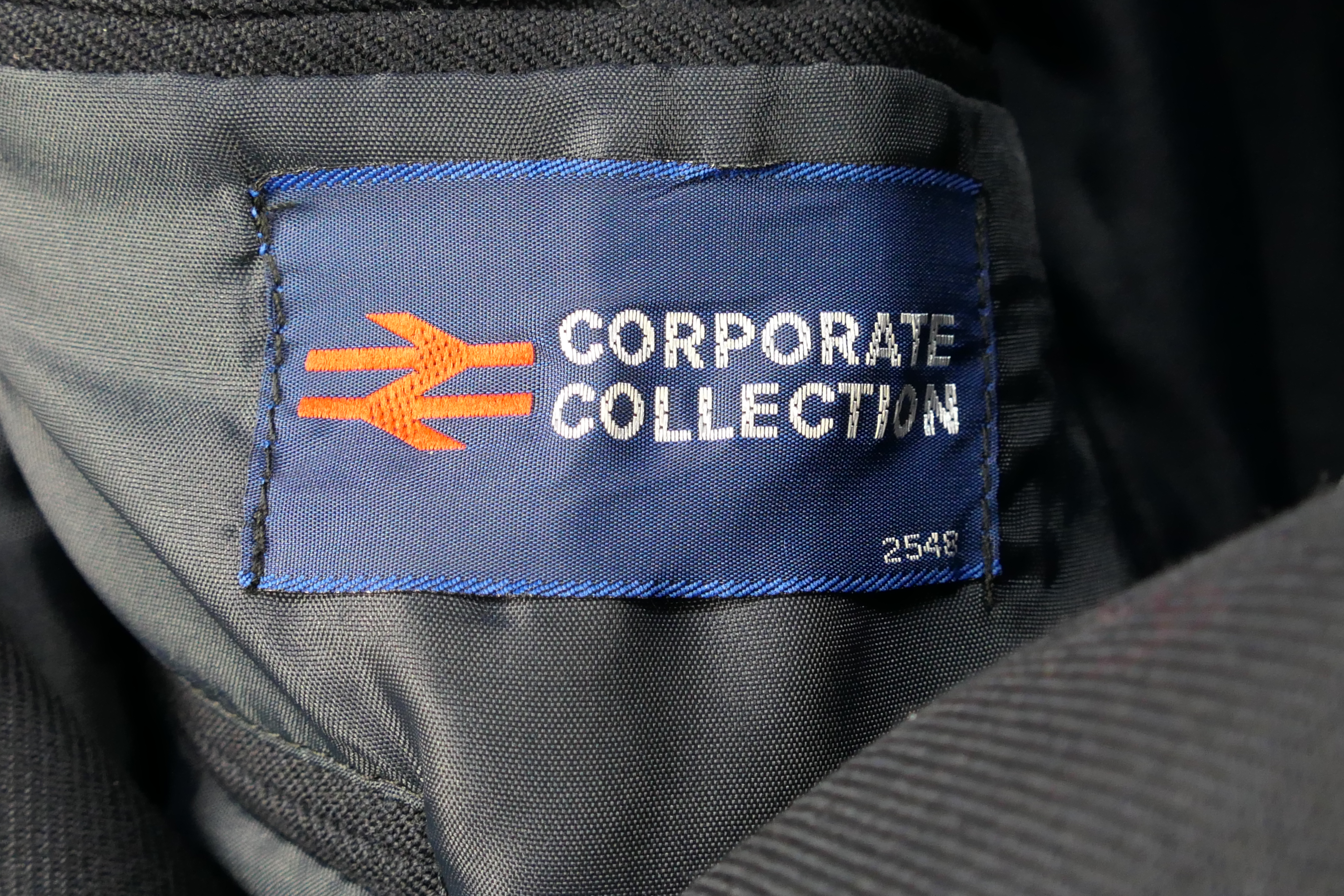 A vintage British Rail jacket with insignia and buttons and a hallmarked silver and enamel lapel - Image 6 of 7