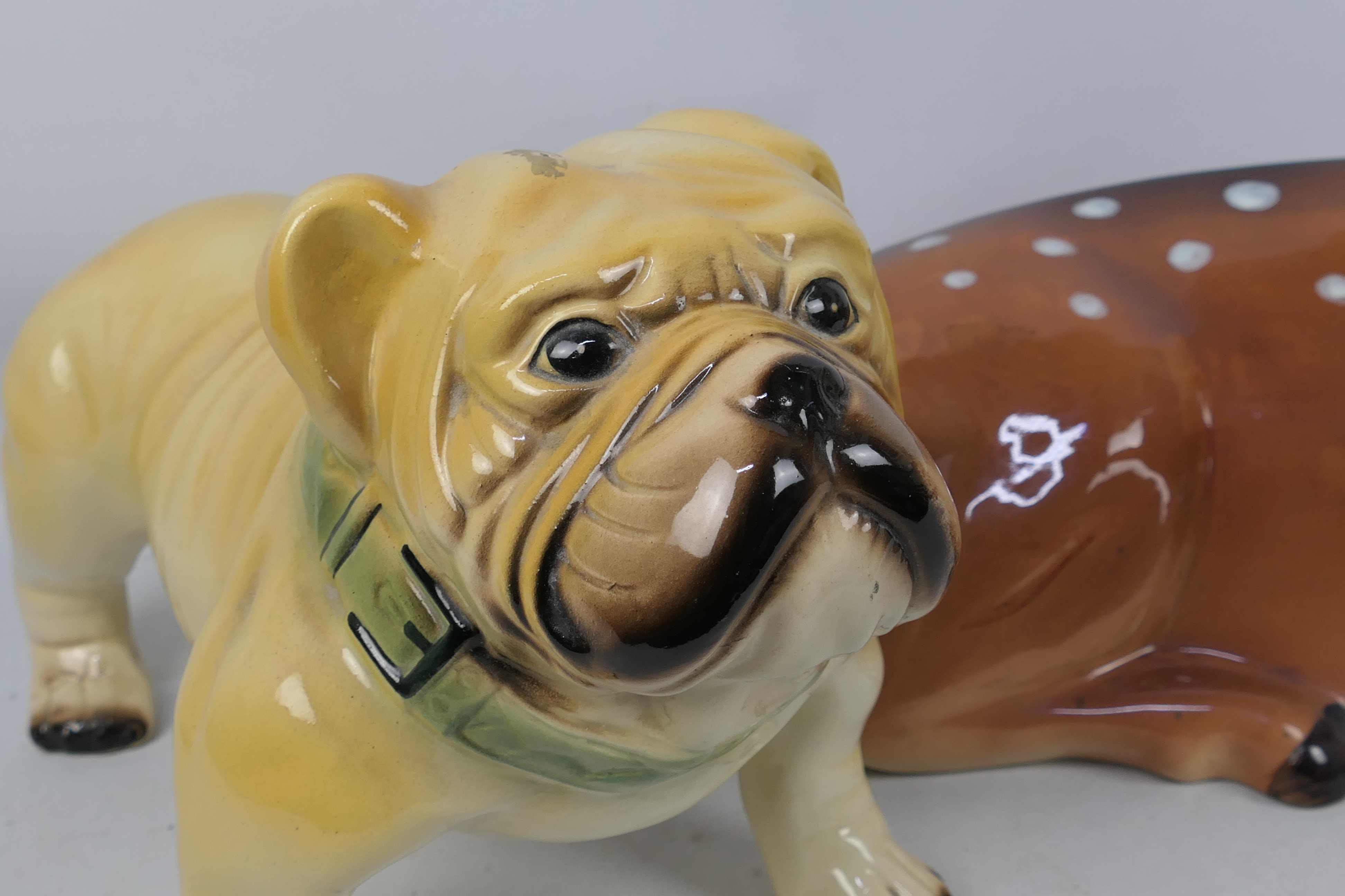 A large ceramic model of a deer, approximately 48 cm (l) and a model of a bulldog. - Image 2 of 5