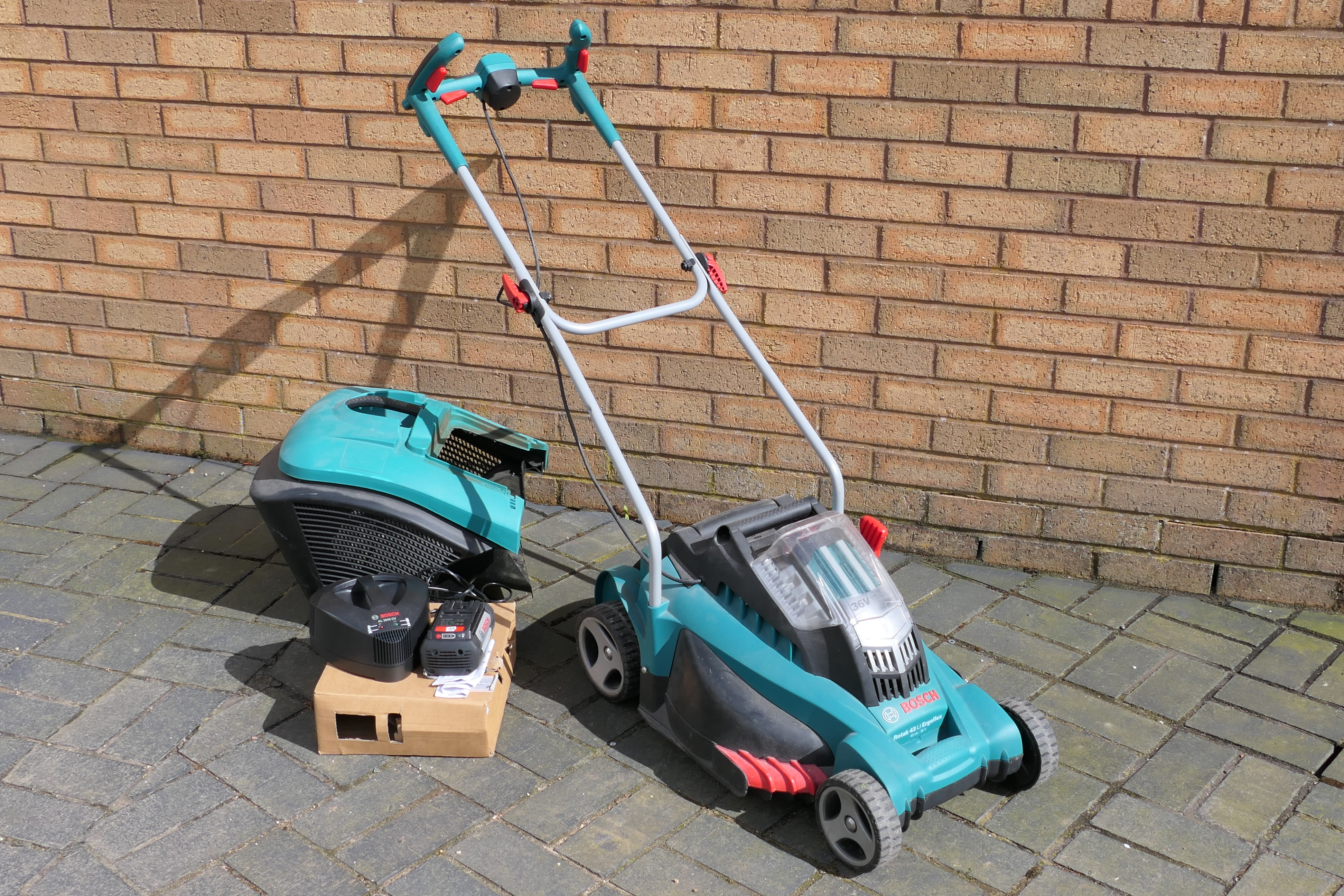 A Bosch Rotak cordless battery lawnmower.