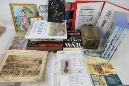 Various military publications, ephemera, respirator and similar.