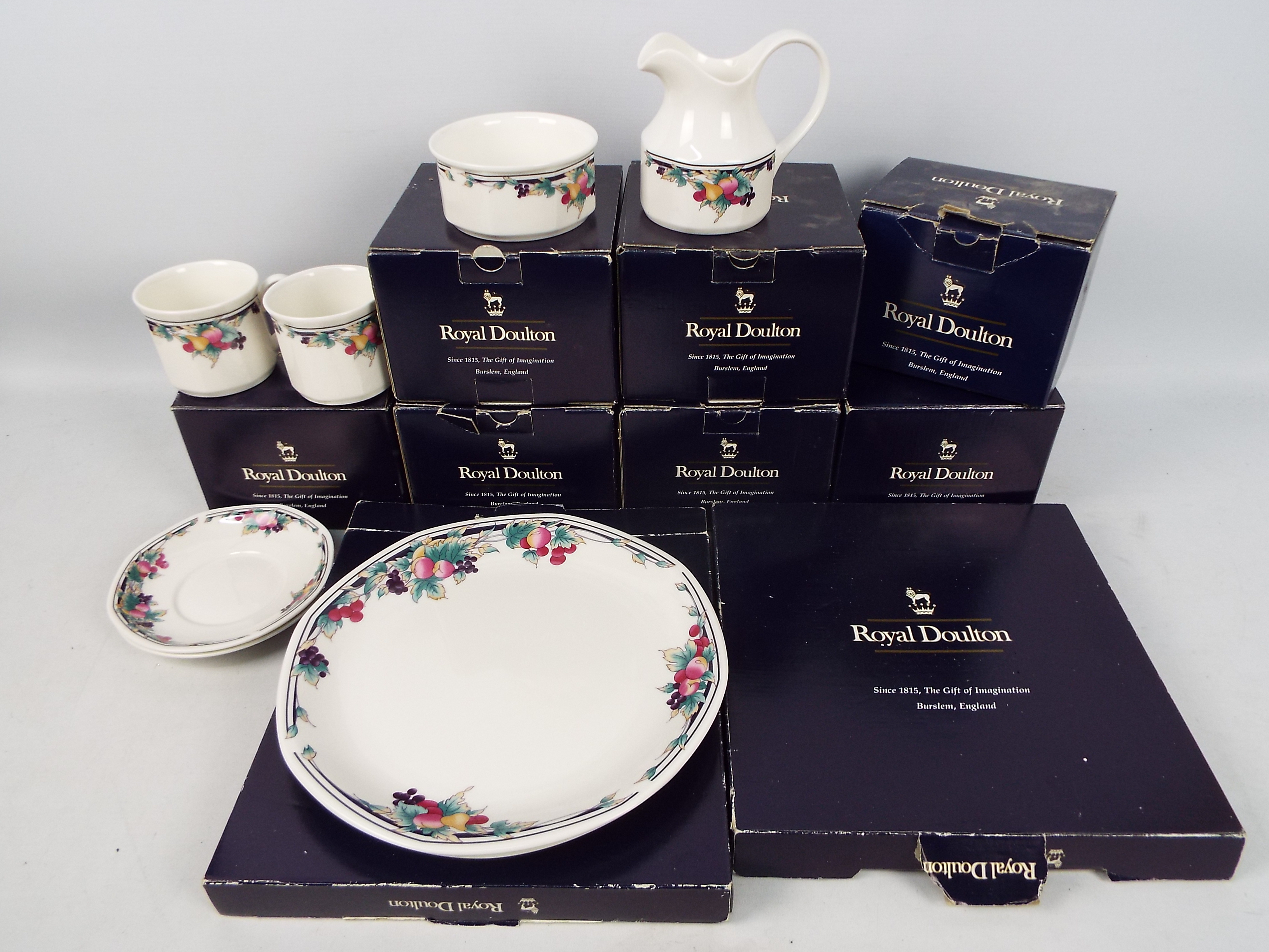 Royal Doulton - A collection of boxed Autumns Glory pattern dinner and tea wares comprising six