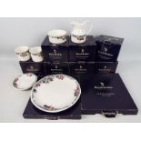 Royal Doulton - A collection of boxed Autumns Glory pattern dinner and tea wares comprising six