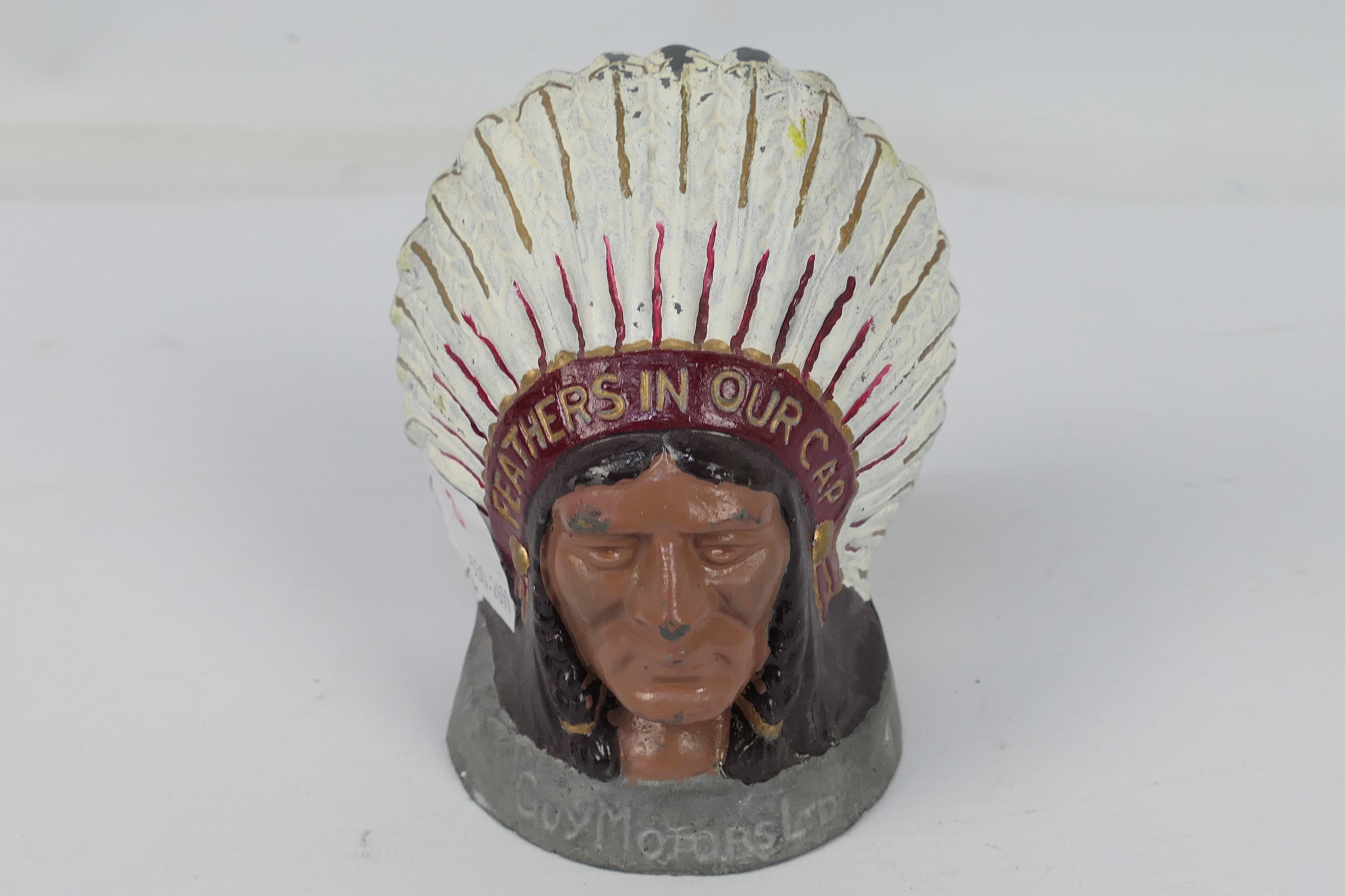 A cast metal Guy Motors Ltd mascot / advertising piece depicting a native American in headdress