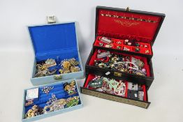 Two jewellery boxes containing a quantity of costume jewellery, rings, earrings, bracelets,
