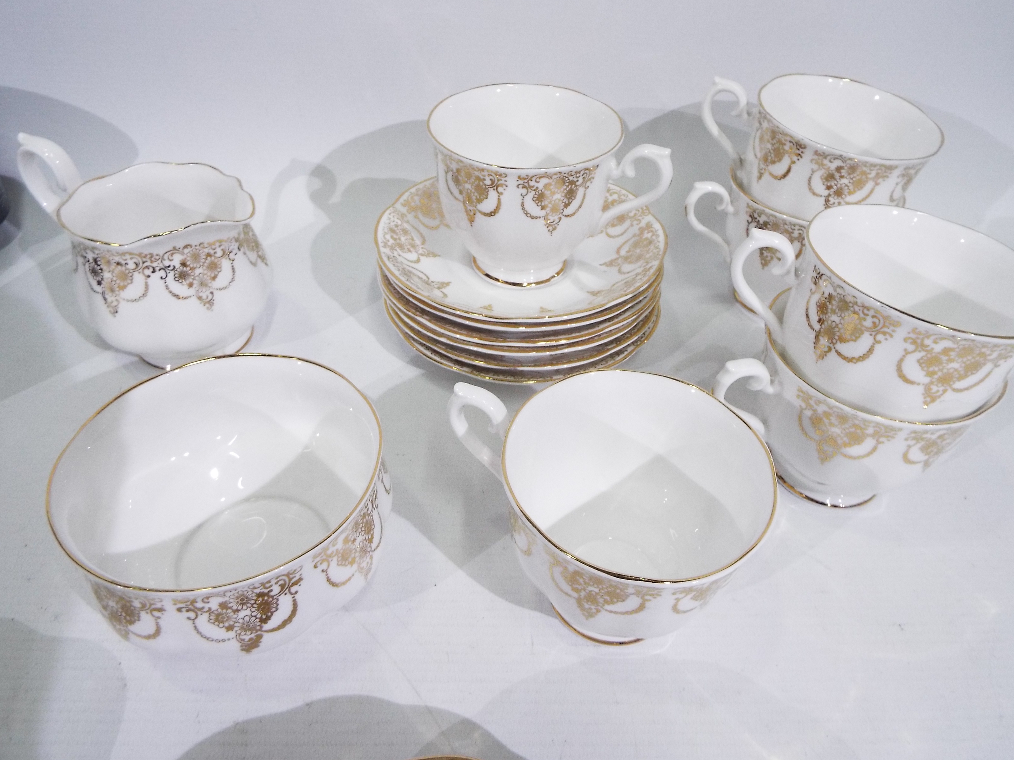 Royal Albert - A collection of tea wares with decoration of gilt floral swags comprising six trios, - Image 4 of 7