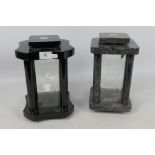 Two hardstone framed candle lanterns, each with four bevelled glass panes, approximately 25 cm (h).