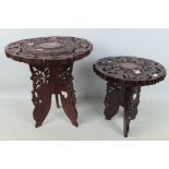 Two carved wood folding occasional tables, largest approximately 40 cm x 37 cm.