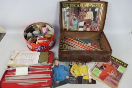 A vintage case and a quantity of haberdashery related items.