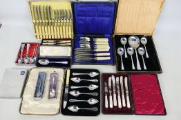 A collection of various flatware, predom