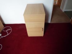 A small light wood filing cabinet measuring approximately 75 cm x 43 cm x 60 cm.