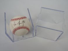 A signed Rawlings baseball contained in