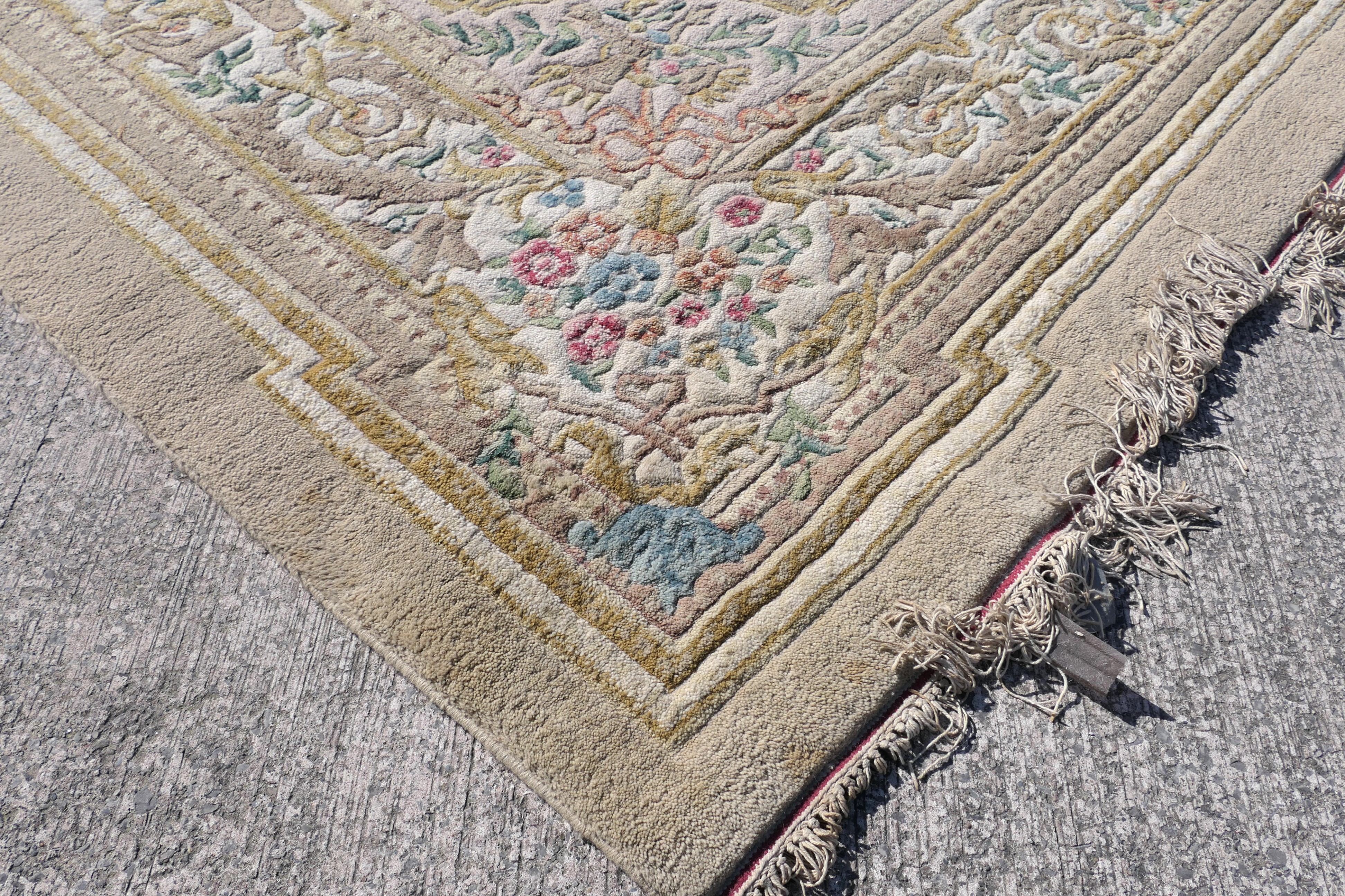 A large wool carpet with central medallion and floral border surround, - Image 5 of 7