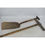 A vintage firing shovel and platelayer's keying hammer (handle 85 cm length).
